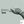 Load image into Gallery viewer, A close-up of the main design shows a photograph of a tattooed male hand measuring a clutch spring with Vernier Calipers.