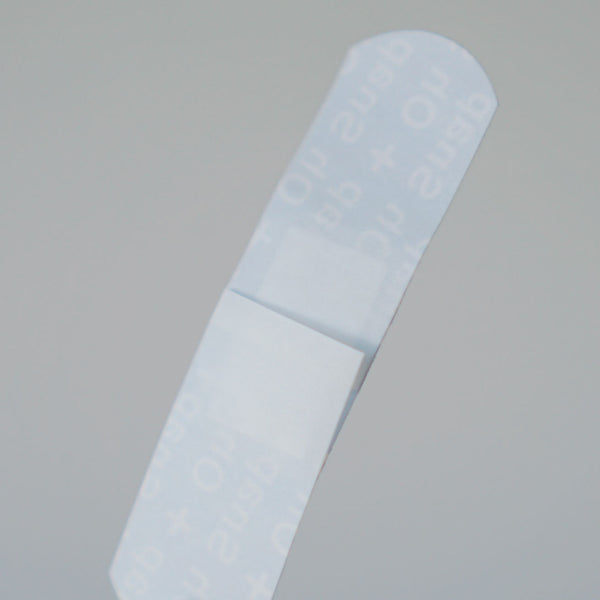 A close-up of the back of a bandaid