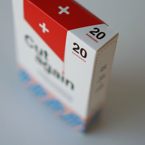 A close up of the corner of the box displaying the text twenty bandages