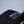 Load image into Gallery viewer, Another close-up of Fault Line's black snapback trucker cap. The front of the cap has an embroidered patch with the logo on it.