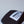 Load image into Gallery viewer, Another close-up of Fault Line's black & white snapback trucker cap. The front of the cap has an embroidered patch with the logo on it.